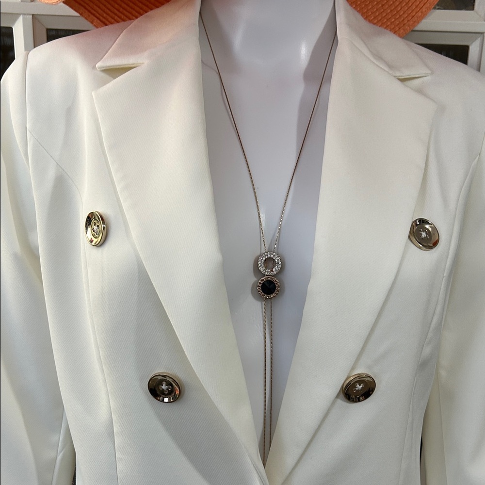 Elegant White Blazer with Orange Hat